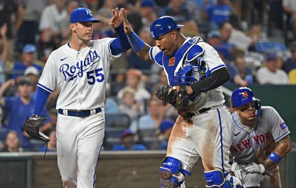 Kansas City Royals catcher Salvador Perez (13) and starting pitcher Cole Ragans (55) celebrate after the final out during the sixth inning against the New York Mets at Kauffman Stadium on Aug. 2, 2023.