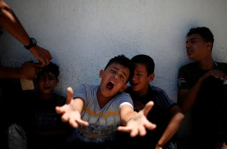 The brother of a Palestinian, who was killed at the Israel-Gaza border, reacts at a hospital in Gaza City June 18, 2018. REUTERS/Mohammed Salem