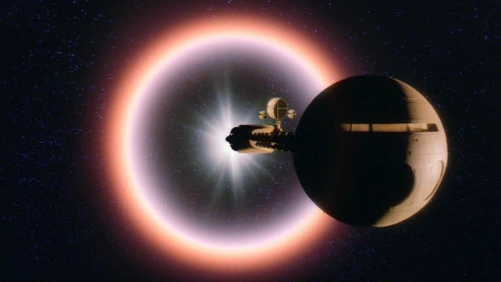 A spaceship flies in outer space in 2010.