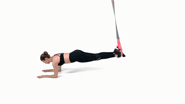 <p><strong>Needed: </strong>TRX<strong>.</strong></p><p><strong>1/</strong> Get into a plank position with your forearms on the floor and feet placed in the TRX loops.</p><p><strong>2/ </strong>From the suspended plank position, rock your body weight forward into your core whilst keeping your muscles stable and strong. Slide back to your starting position and repeat.</p>
