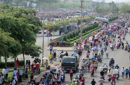 Workers of Pou Yuen Vietnam gather at their factory on the fifth day of a strike in Vietnam's southern Ho Chi Minh City March 31, 2015. REUTERS/Stringer