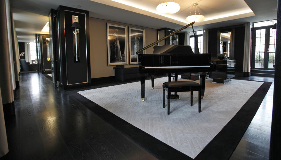 This Friday, March, 16, 2012 photo shows a reception room with baby grand piano and large desk in one of the five bedroom luxury penthouse apartments overlooking Hyde Park, London which is available for hire during the London 2012 Olympics for some 11,000 British pounds (US$17,600) a night - and includes a maid a butler and and Aston Martin car. Most of London's most exclusive hotels have been booked for the Olympics, snapped up by Olympic officials or companies block-booking rooms for favored customers, but there are still amazing places to stay. That is, if you can afford the bill.(AP Photo/Alastair Grant)