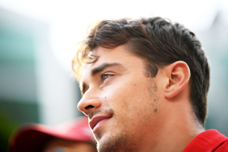 SINGAPORE - SEPTEMBER 21: Charles Leclerc of Monaco and Ferrari looks on in the Paddock before final practice for the F1 Grand Prix of Singapore at Marina Bay Street Circuit on September 21, 2019 in Singapore. (Photo by Clive Mason/Getty Images)