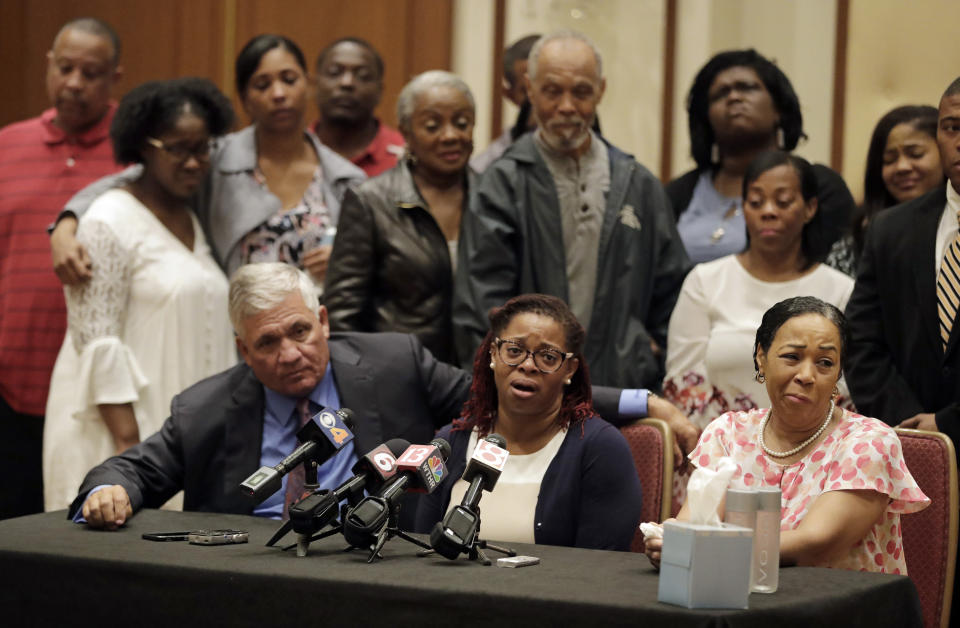 Kyrie Rose, middle, speaks as Robert Mongeluzzi, left, and Lisa Berry listen during a news conference regarding the July 19 duck boat accident, Tuesday, July 31, 2018, in Indianapolis. A second lawsuit has been filed by members of an Indiana family who lost nine relatives when a tourist boat sank this month in Missouri. The federal lawsuit was filed Tuesday in Missouri on behalf of the estates of two members of the Coleman family. They were among 17 people killed in the July 19 sinking near Branson. (AP Photo/Darron Cummings)