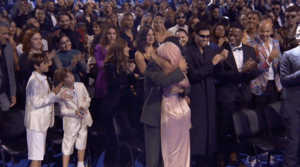 Feid and Karol G embraced after she won best urban album of the year at the 2023 Latin Grammys. (Univision)