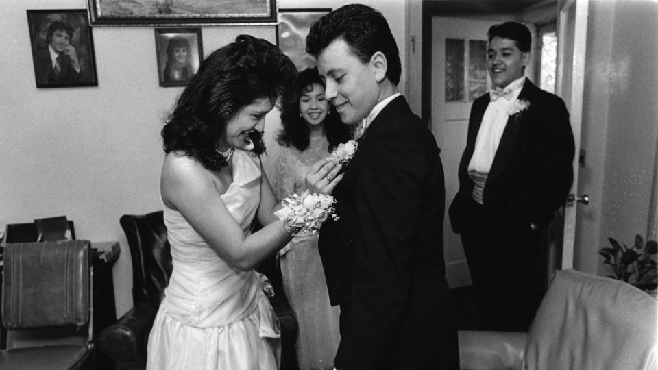 Josephine Alvarez pins a boutonniere on her prom date