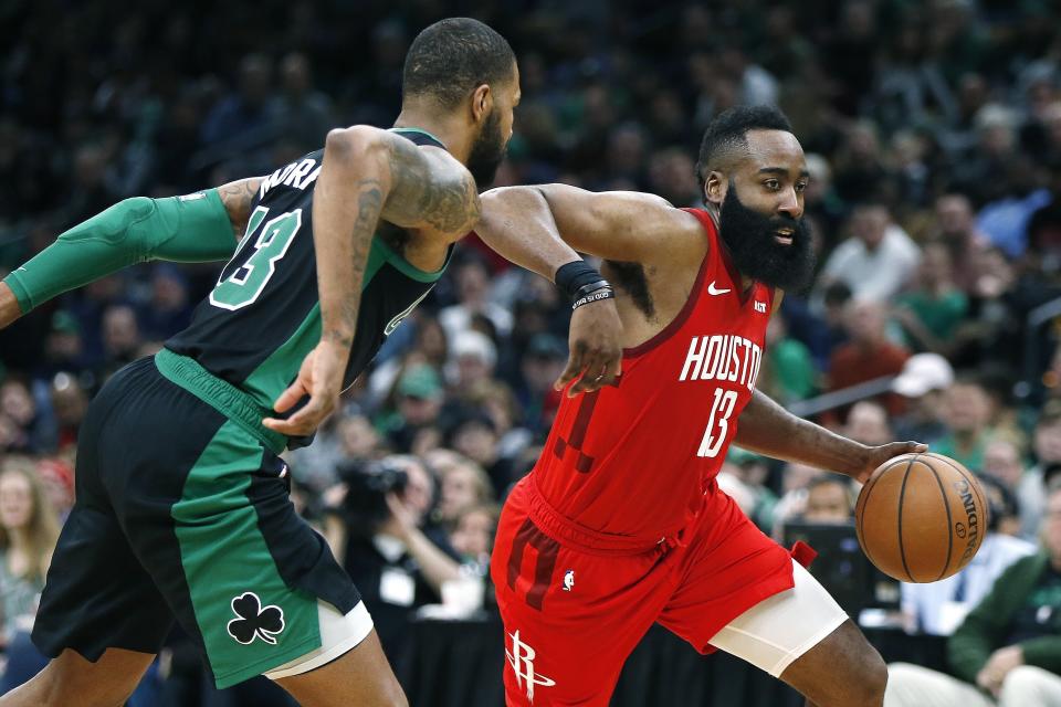 Houston Rockets' James Harden, right, drives past Boston Celtics' Marcus Morris during the second half of an NBA basketball game in Boston, Sunday, March 3, 2019. (AP Photo/Michael Dwyer)