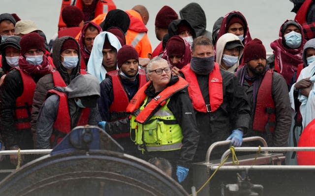 A group of people thought to be migrants being brought in to Dover, Kent