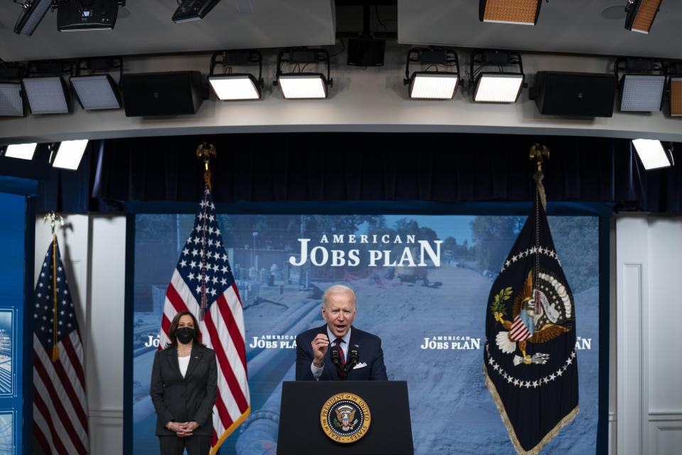 President Joe Biden speaks during an event on the American Jobs Plan in the South Court Auditorium on the White House campus, Wednesday, April 7, 2021, in Washington. Vice President Kamala Harris is at left. (AP Photo/Evan Vucci)