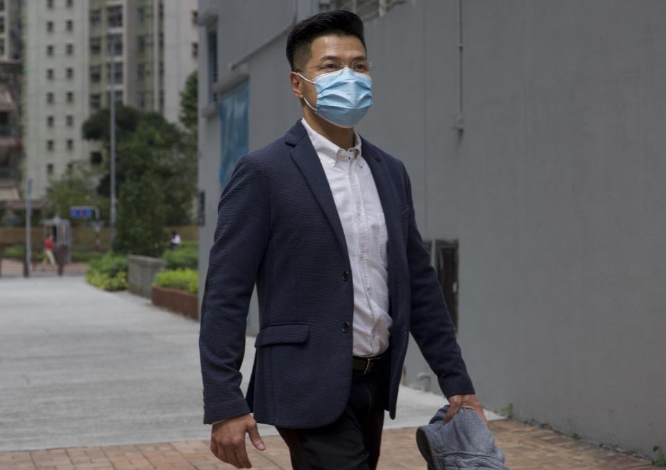 Former legislator and District Council member Gary Fan who was arrested under Hong Kong's national security law arrives at a police station in Hong Kong Sunday, Feb. 28, 2021. Across Hong Kong, dozens of others including former lawmakers and democracy advocates who were arrested in connection with Hong Kong's new National Security Law, went back into a police station Sunday, following a surprise request from police Friday. (AP Photo/Vincent Yu)