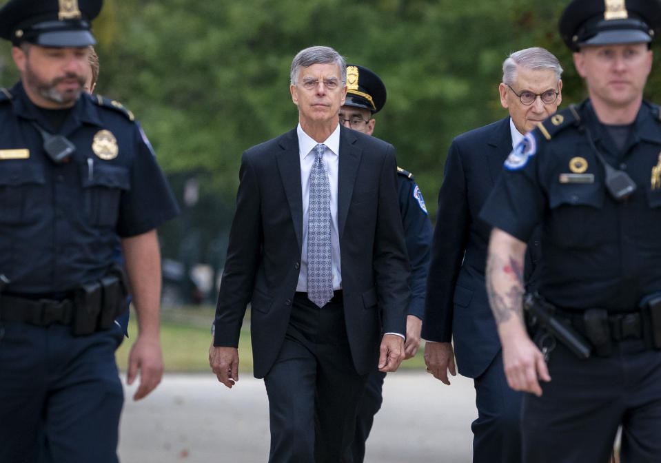 Ambassador William Taylor, is escorted by U.S. Capitol Police as he arrives to testify before House committees as part of the Democrats' impeachment investigation of President Donald Trump, at the Capitol in Washington, Tuesday, Oct. 22, 2019. (AP Photo/J. Scott Applewhite)