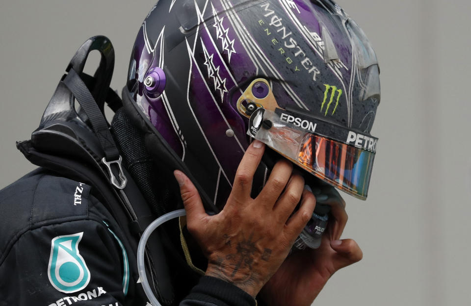 Mercedes driver Lewis Hamilton of Britain reacts after winning the Turkish Formula One Grand Prix at the Istanbul Park circuit racetrack in Istanbul, Sunday, Nov. 15, 2020. (Murad Sezer/Pool via AP)