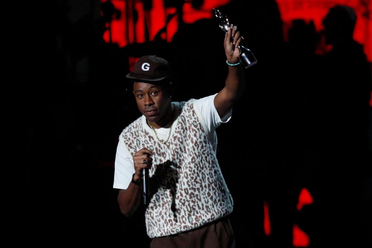 Tyler the Creator collects his award for International Male Solo Artist during the 2020 Brit Awards on 18 February 2020 in London: ADRIAN DENNIS/AFP via Getty Images