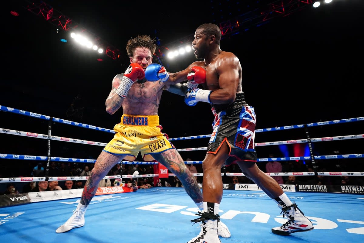 Aaron Chalmers (left) and Floyd Mayweather during their exhibition fight (Zac Goodwin/PA). (PA Wire)