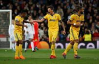 <p>Soccer Football – Champions League Quarter Final Second Leg – Real Madrid vs Juventus – Santiago Bernabeu, Madrid, Spain – April 11, 2018 Juventus’ Mario Mandzukic celebrates with Alex Sandro after scoring their second goal REUTERS/Stringer </p>