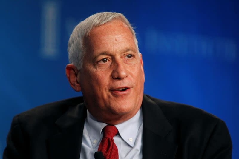 FILE PHOTO: Isaacson, president and CEO of the Aspen Institute moderates an event at the Milkten Institute Global Conference in Beverly Hills