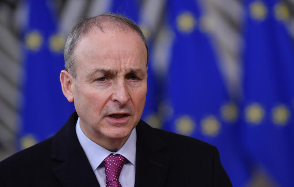 Ireland's Prime Minister Micheal Martin speaks as he arrives for an EU summit at the European Council building in Brussels, Thursday, Dec. 10, 2020. European Union leaders meet for a year-end summit that will address anything from climate, sanctions against Turkey to budget and virus recovery plans. Brexit will be discussed on the sidelines. (John Thys, Pool via AP)