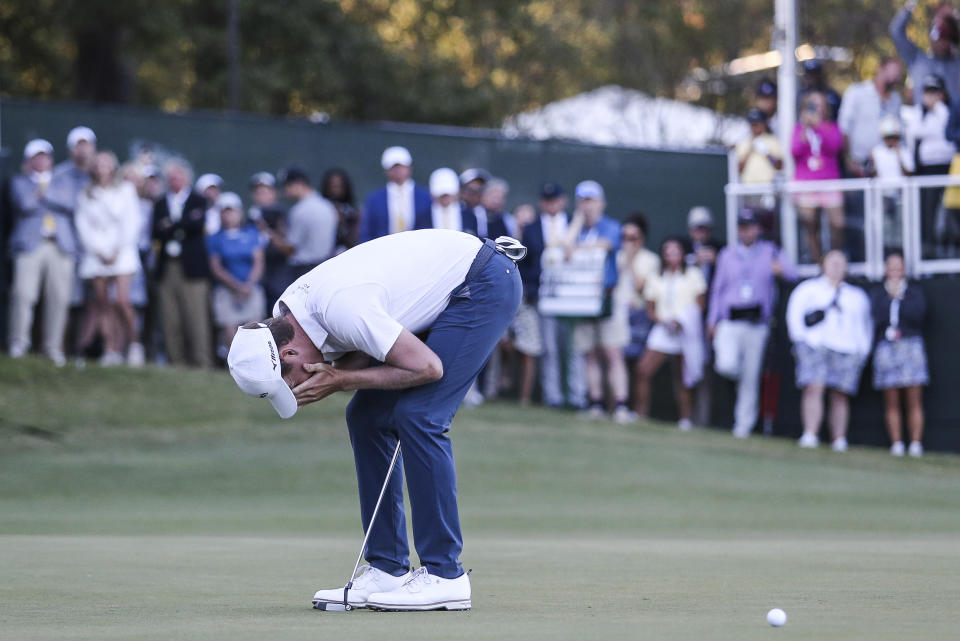 Ben Griffin reacts aftermissing par on the 18th green that led to a five-man playoff hole during the final round of the Sanderson Farms Championship golf tournament in Jackson, Miss., Sunday, Oct. 8, 2023. (James Pugh/impact601.com via AP)