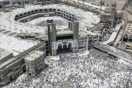 Muslim pilgrims walk out after the Friday prayer at the Grand mosque ahead of annual Haj pilgrimage in the holy city of Mecca, Saudi Arabia August 17, 2018.REUTERS/Zohra Bensemra