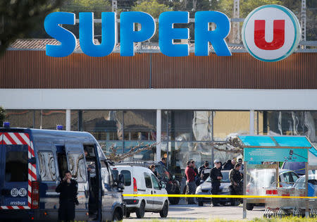 A general view shows gendarmes and police officers at a supermarket after a hostage situation in Trebes, France, March 23, 2018. REUTERS/Regis Duvignau