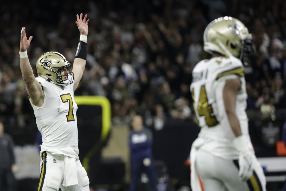 New Orleans Saints quarterback Taysom Hill (7) celebrates a touchdown against the Dallas Cowboys during the first half of an NFL football game, Thursday, Dec. 2, 2021, in New Orleans. (AP Photo/Derick Hingle)