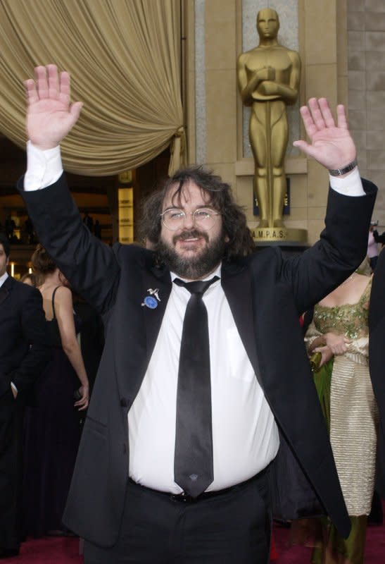 Peter Jackson, the director of "The Lord of the Rings: The Return of the King," hams it up for photographers as he arrives for the 76th Annual Academy Awards held at the Kodak Theatre, February 29, 2004, in Los Angeles. File Photo by Jim Ruymen/UPI