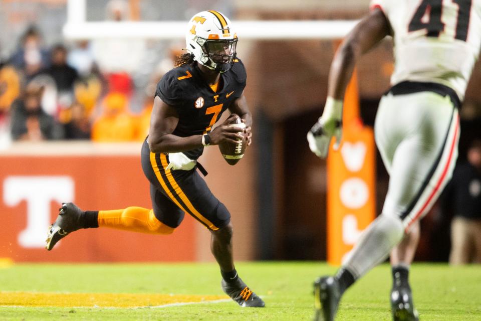 Tennessee quarterback Joe Milton III (7) runs with the ball during a football game against the Georgia Bulldogs at Neyland Stadium in Knoxville, Tenn. on Saturday, Nov. 13, 2021.