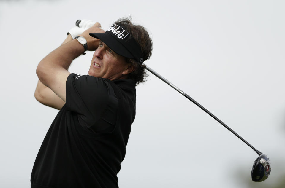 Phil Mickelson watches his tee shot on the second hole of the South Course during the second round of the Farmers Insurance Open golf tournament Friday, Jan. 24, 2014, in San Diego. (AP Photo/Gregory Bull)