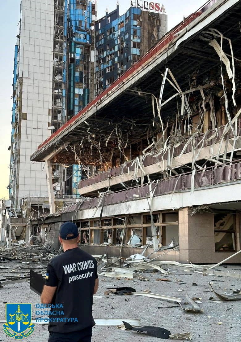 A member of Odesa Regional Prosecutor's Office personnel inspects damage following a Russian military attack. (via REUTERS)