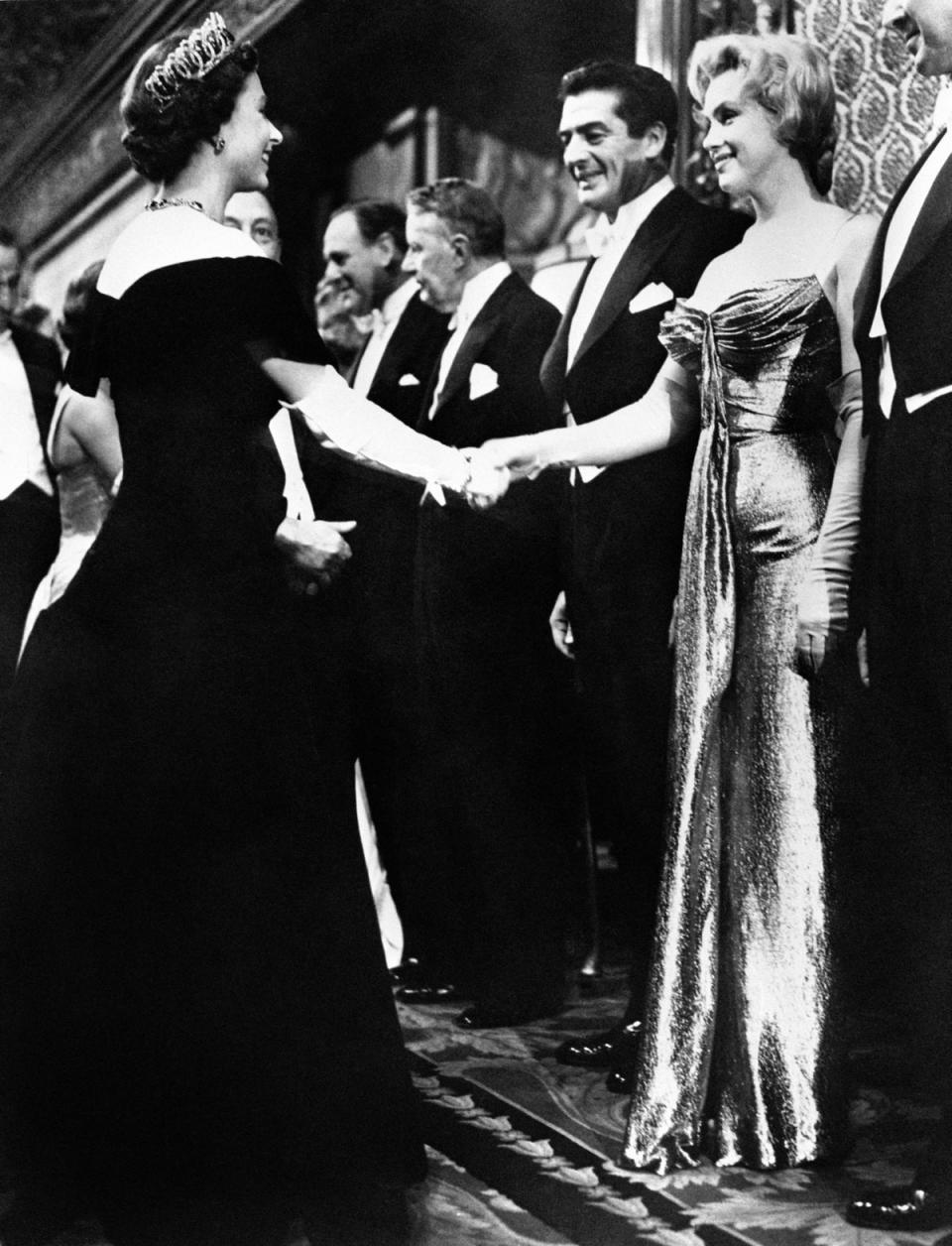 Marilyn Monroe shaking hands with the Queen at the Royal Command Film Performance in 1956 (PA) (PA Archive)