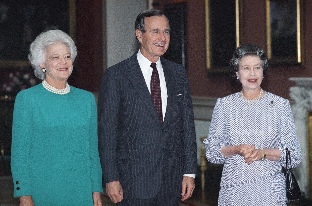 President George H.W. Bush (41st president) and First Lady Mrs. Bush pose with Queen Elizabeth II on June 1, 1989 in London at Buckingham Palace, where the queen hosted a lunch for the first family.