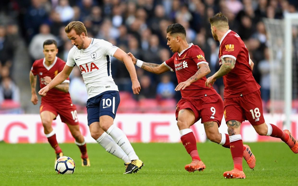 Liverpool try (and fail) to contain Tottenham's Harry Kane who scored twice in a resounding 4-2 victory - Getty Images Europe