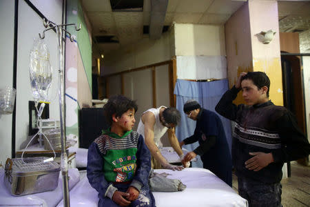 ATTENTION EDITORS - VISUAL COVERAGE OF SCENES OF INJURY Wounded children are seen in a hospital in the besieged town of Douma, Eastern Ghouta, Damascus, Syria February 23, 2018. REUTERS/Bassam Khabieh