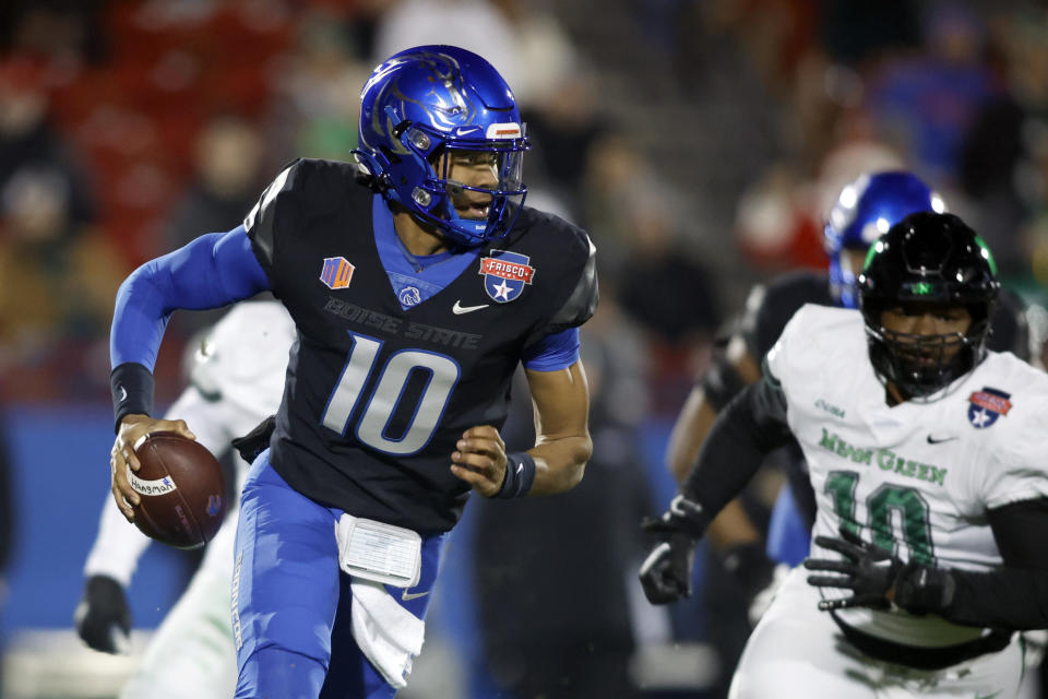 Dec 17, 2022; Frisco, Texas, USA; Boise State Broncos quarterback <a class="link " href="https://sports.yahoo.com/ncaaf/players/323020" data-i13n="sec:content-canvas;subsec:anchor_text;elm:context_link" data-ylk="slk:Taylen Green;sec:content-canvas;subsec:anchor_text;elm:context_link;itc:0">Taylen Green</a> (10) scrambles out of the pocket against the North Texas Mean Green in the first half at Toyota Stadium. Mandatory Credit: Tim Heitman-USA TODAY Sports