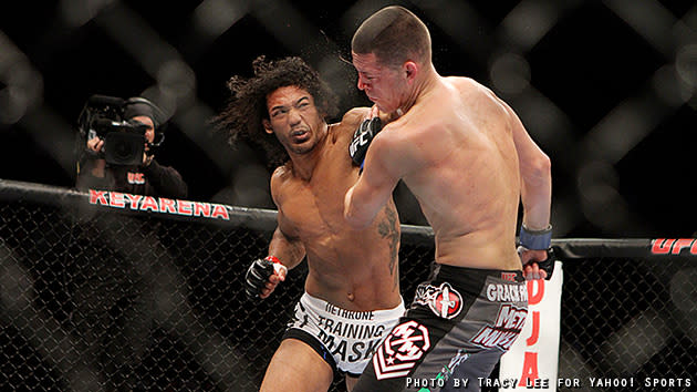 Benson Henderson catches Nate Diaz with a left to the chin. (Credit: Tracy Lee for Yahoo! Sports)