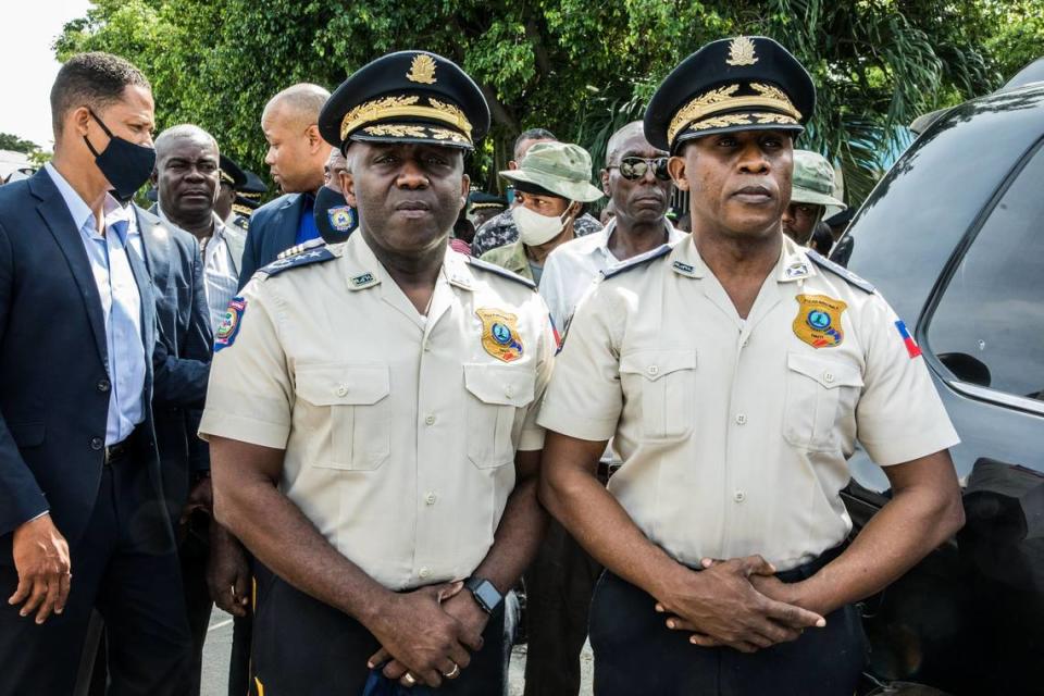 The new director general of the Haiti National Police, Léon Charles, left, and outgoing police director Rameau Normil attend a ceremony in Port-au-Prince, Haiti, on November 16, 2020.
