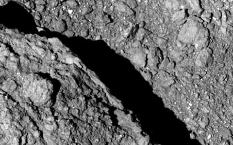 This image taken at an altitude of about 64 metres by Hayabusa2 by the Japan Aerospace Exploration Agency (JAXA) shows the surface of asteroid Ryugu - Credit: AP