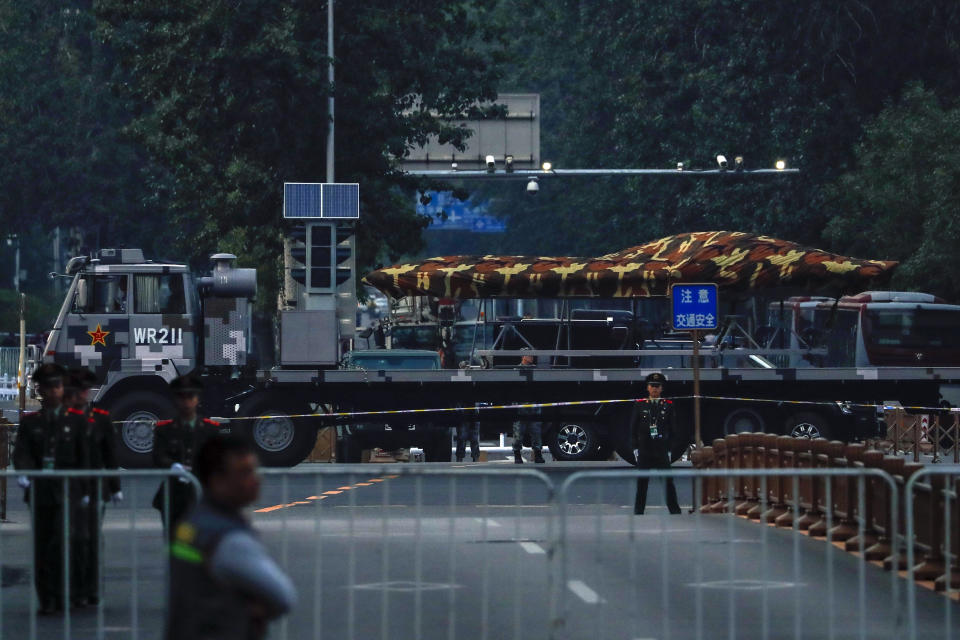 In this Saturday, Sept. 21, 2019, photo, a Chinese military vehicle possibly carrying a drone passes along the Jianguomenwai Avenue during a rehearsal for the 70th anniversary of Communist China, in Beijing. A parade on Tuesday, Oct. 1 by China’s secretive military will offer a rare look at its rapidly developing arsenal, including possibly a nuclear-armed missile that could reach the United States in 30 minutes, as Beijing gets closer to matching Washington and other powers in weapons technology. (AP Photo/Andy Wong)