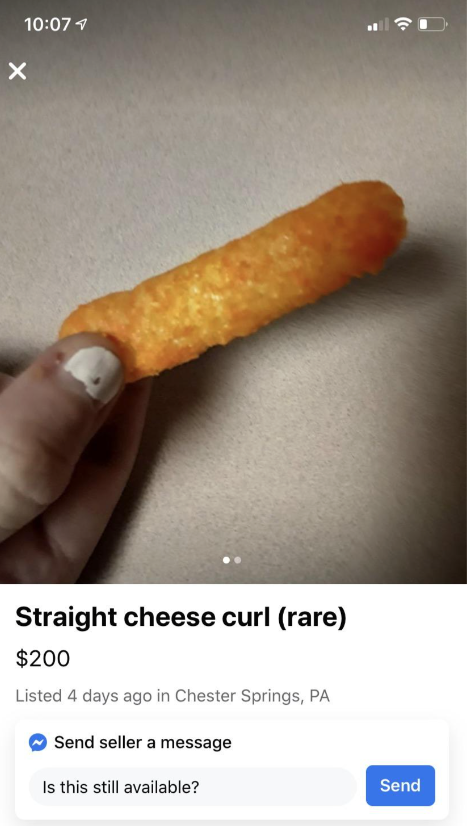 Person holding a cheese curl with a humorous price tag listed as a rare item for sale