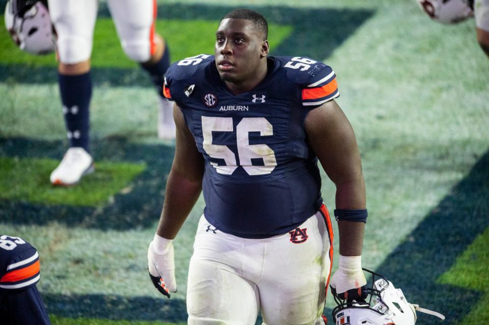 Auburn offensive lineman Tashawn Manning (56) walks off the field after the game at Jordan-Hare Stadium in Auburn, Ala., on Saturday, Nov. 21, 2020. Auburn defeated Tennessee 30-17.