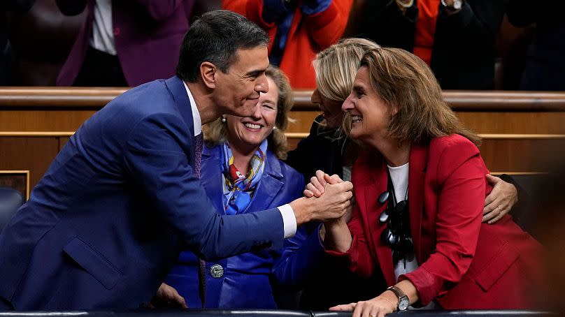 Sánchez celebrates with party members after he was chosen by a majority of legislators to form a new government after a parliamentary vote on Thursday.
