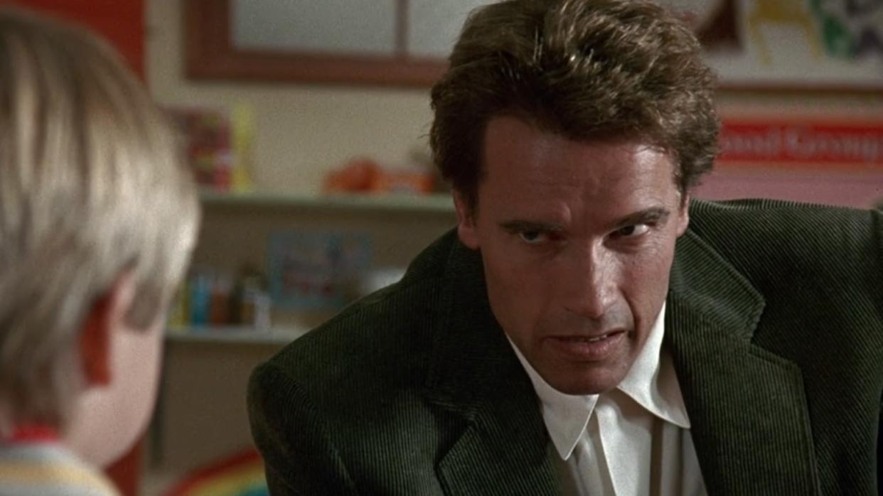  Arnold Schwarzenegger staring angrily at a kid in Kindergarten Cop. 