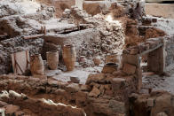 In this handout photo provided by the Greek Prime Minister's Office , ancient jars are seen inside the 16th century BC archaeological site of Akrotiri at the Greek island of Santorini . Greek Prime Minister Kyriakos Mitsotakis visited Saturday Santorini to announce the opening of the tourist season. (Dimitris Papamitsos/ Greek Prime Minister's Office via AP)