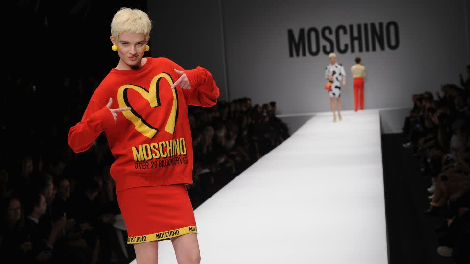 In a McDonalds inspired twinset, a model walks the runway at the Fall-Winter 2014 Moschino fashion show during Milan Fashion Week on February 20, 2014. - Jacopo M. Raule/Getty Images