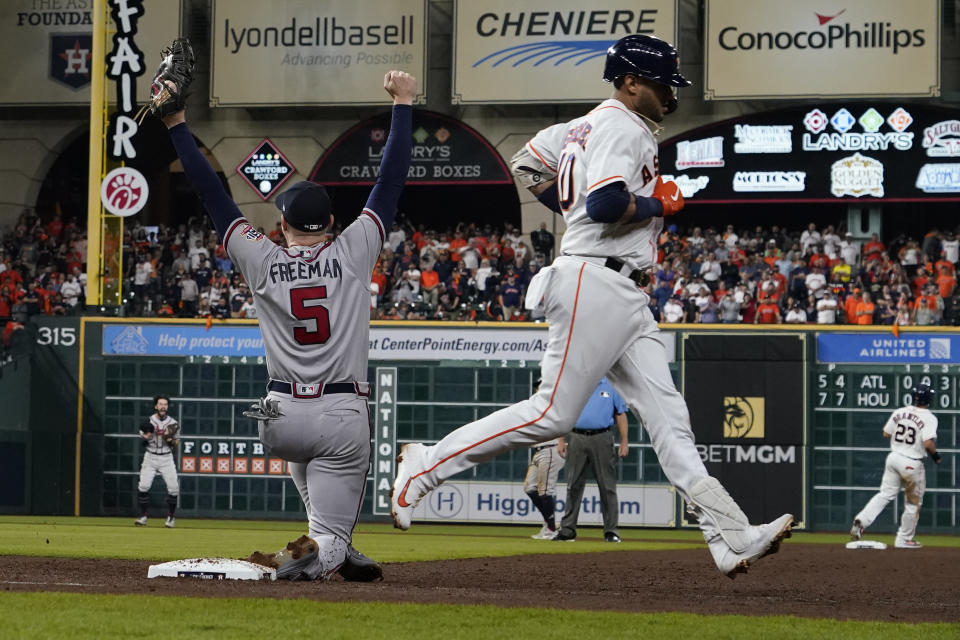 Atlanta Braves first baseman Freddie Freeman celebrates after Houston Astros' Yuli Gurriel made the last out to win baseball's World Series in Game 6 against the Houston Astros Tuesday, Nov. 2, 2021, in Houston. The Braves won 7-0. (AP Photo/David J. Phillip)