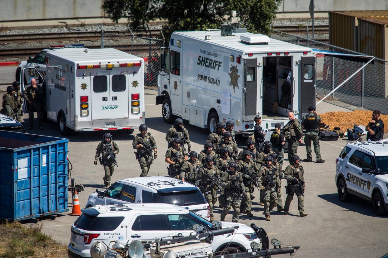 Tactical law enforcement officers move through the Valley Transportation Authority (VTA) light-rail yard where a mass shooting occurred on May 26, 2021 in San Jose, California (Getty Images)