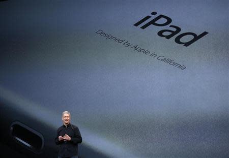 Apple Inc CEO Tim Cook speaks about the new iPad Air during an Apple event in San Francisco, California October 22, 2013. REUTERS/Robert Galbraith