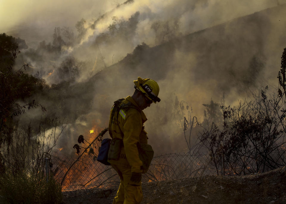 Wildfire along a hillside in Azusa, Calif.