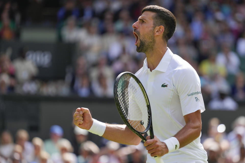 Serbia's Novak Djokovic reacts after winning a point against Britain's Jacob Fearnley during their second round match at the Wimbledon tennis championships in London, Thursday, July 4, 2024. (AP Photo/Kirsty Wigglesworth)