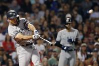 New York Yankees' Giancarlo Stanton hits a grand slam during the eighth inning of a baseball game against the Boston Red Sox, Saturday, Sept. 25, 2021, in Boston. (AP Photo/Michael Dwyer)